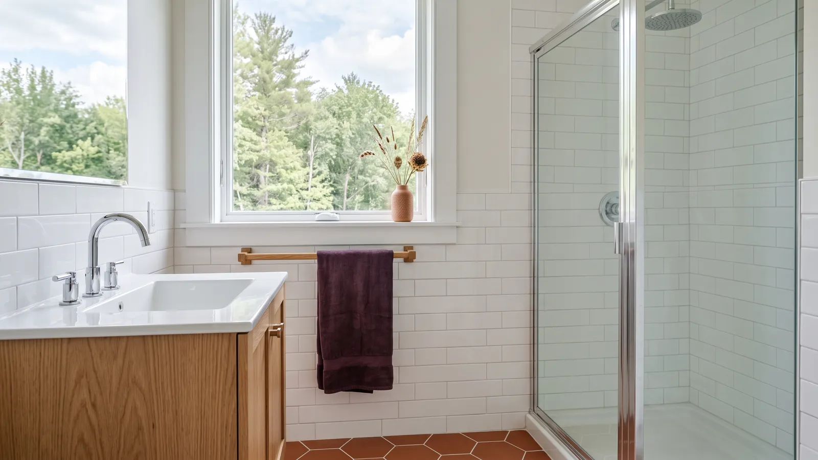 A newly renovated guest bathroom, clean and dust-free, with tiled walls and a polished faucet.